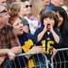Vicky Kott, of St. Petersburg, holds her grandson Lukas Kott, 4, of Tampa, as he shouts "Let's Go Blue" during the Outback Bowl New Year's eve parade in Ybor City, Fla. on Monday night. Melanie Maxwell I AnnArbor.com
